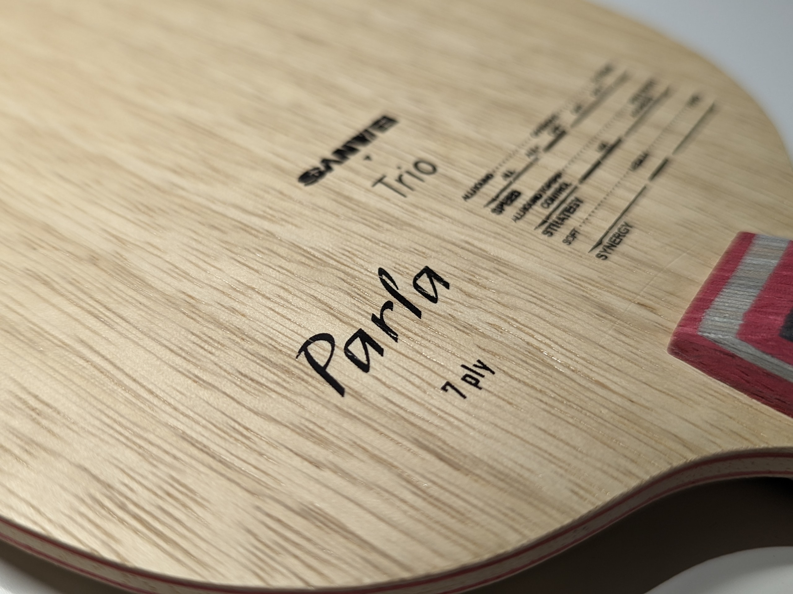 Printing on the front of the Sanwei Parla table tennis blade showing the name and technical details
